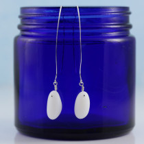 Beautiful, opaque while, milk glass/sea glass earrings on long, sterling silver ear wires. Stylish design from A Day at the Beach Fine Sea Glass Jewerly
