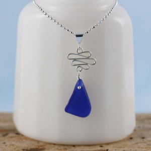 Rare Cobalt Blue Sea Glass Necklace from A Day at the Beach Fine Sea Glass Jewelry. This is the actual sea glass pendant/necklace that you will receive. Genuine and beach found. With your choice of sterling silver necklace lengths.