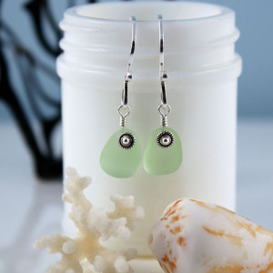 UV Green Sea Glass Earrings with Sterling Silver Ear Wires. Sea glass glows in the dark! One-of-a-kind. Available for fast, free shipping.
