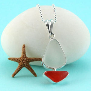 Come Sail Away With Me! Our ultra rare yellow and orange sea glass pendant bezel set in sterling silver is the quintessential gift for your sea faring sea glass lover. This piece is like no other for someone extraordinary! The sea glass is surrounded by sterling silver to enhance the sailboat shape. It is genuine, beach found and not altered in shape or size. We offer free shipping, free gift wrap and a money back guarantee. The sea glass sailboat pendant comes with a sterling silver, diamond cut bead necklace from Italy. You may choose your necklace length below! We are full time sea glass artists dedicated to bringing you the best quality, natural sea glass creations. Metal: Sterling Silver Bezel, Bail and Necklace Origin of Sea Glass: Yellow Is From Hawaii; Orange Is From United Kingdom Rarity: Yellow is Rare; Orange Is Extremely Rare Birthstone Equivalent: Yellow=Tourmaline, the October Birthstone; Orange=Topaz, the November Birthstone Size of Pendant: Small, 1-1/2" Long, 5/8" Wide at its Widest [cc_product sku="n491" display="inline" quantity="true" price="true"] View All Sea Glass Sailboat Necklaces Here!. Genuine Sea Glass. Sterling Silver.