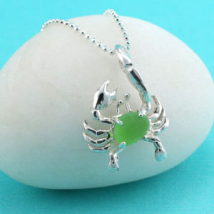 Also known as the elusive "spider of the sea," the Crab is a popular symbol representing self protection and security. It is also the Zodiac character for the period, June 22 - July 22. There is nothing more appealing than this this sterling silver, rare turquoise green sea glass crab pendant that comes with a beautiful sterling silver necklace in your choice of lengths. Be the first to wear this one of a kind design or gift it to someone you love who has a strong imagination, and is romantic, loving and affectionate. Order today and we will provide free, premium gift wrap, free priority shipping and a $$ back guarantee if you are not thrilled with your purchase! Metal: Sterling Silver Necklace and Crab Origin of Sea Glass: Nova Scotia Rarity: Turquoise/Green is Extremely Rare Birthstone Equivalent:Turquoise/Green=Emerald, the May Birthstone Size of Sea Glass: Small, @1/2" x 1/4" Size of Crab Pendant: Small: 1-1/8" Long, 3/4" Wide [cc_product sku="n682" display="inline" quantity="true" price="true"] View More Turquoise Sea Glass Jewelry Here!